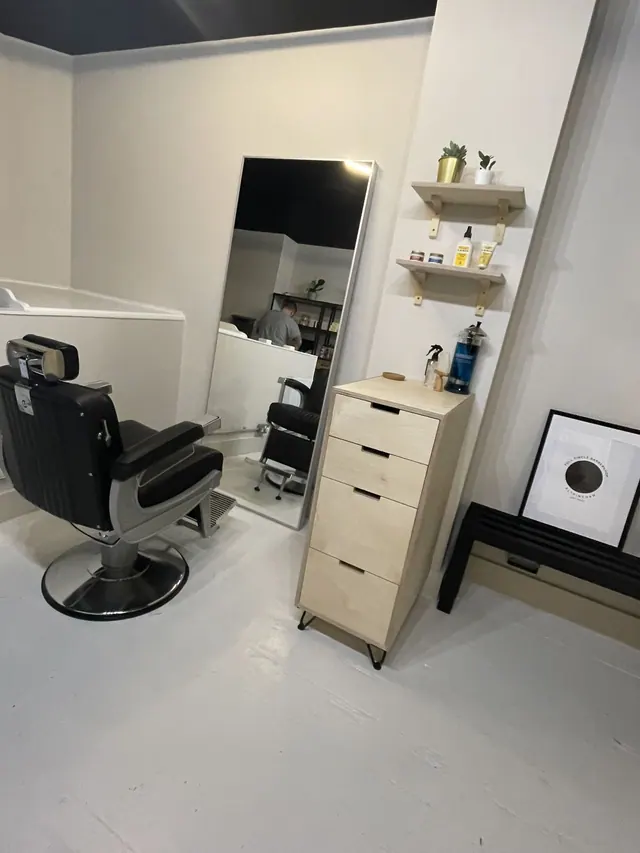 The barber chair and shelves at Full Circle